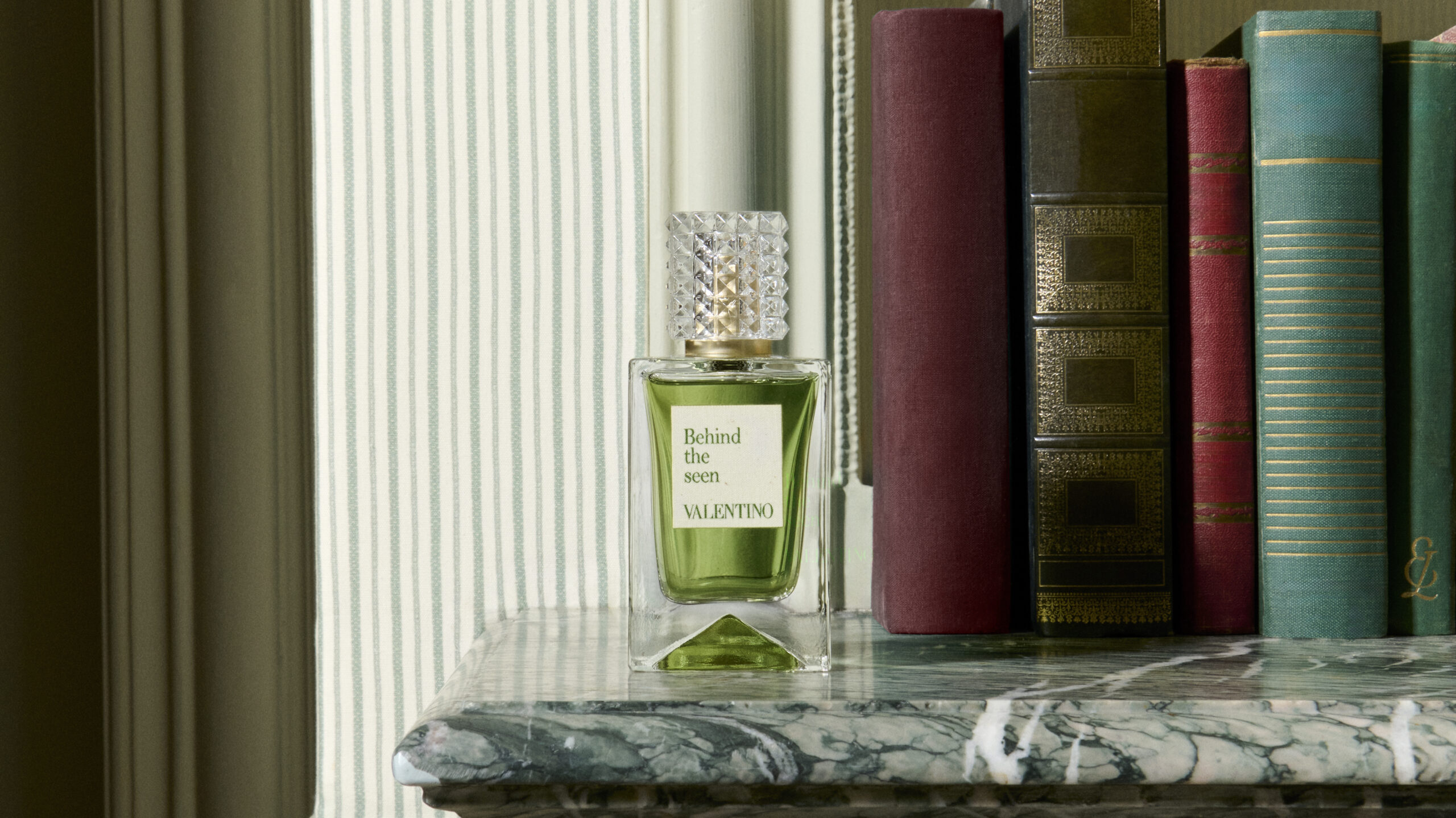 A perfume bottle is positioned for Valentino's Analog of Dreams campaign