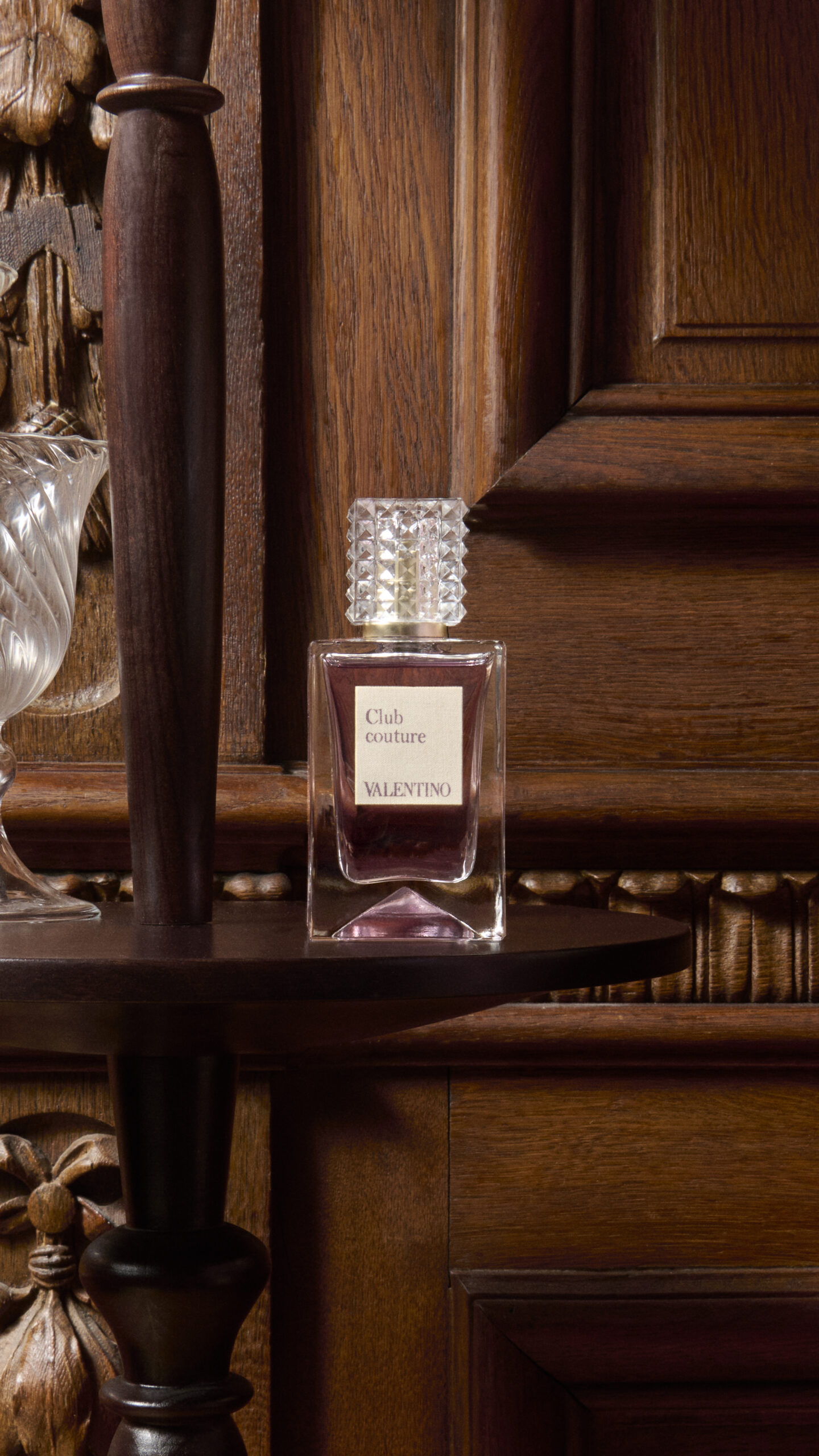 A perfume bottle is positioned for Valentino's Analog of Dreams campaign