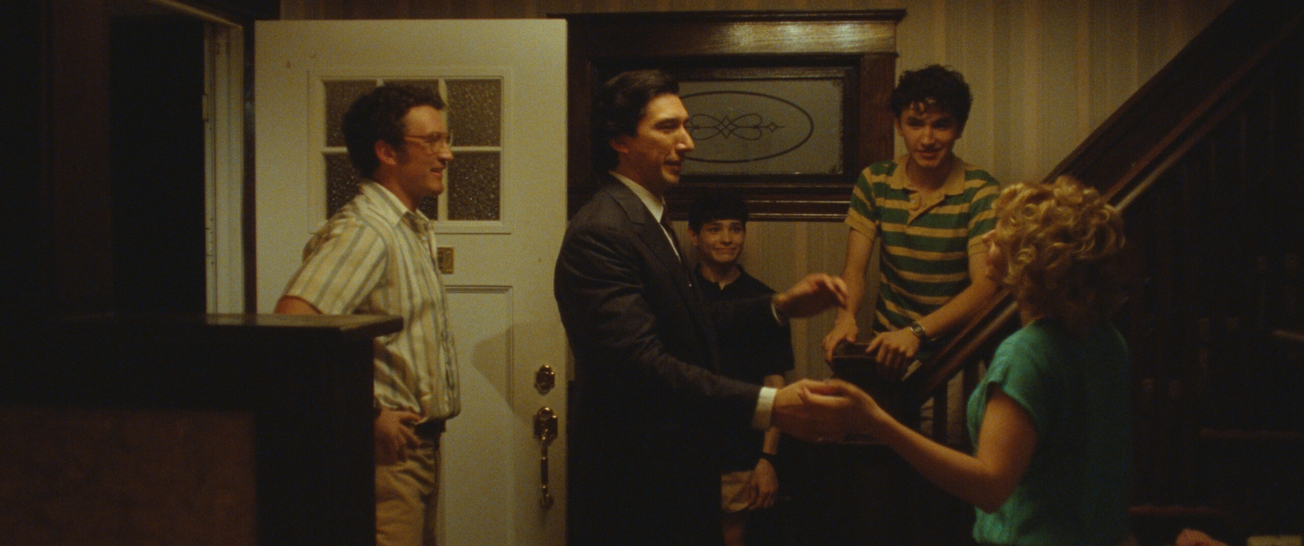 Miles Teller, Adam Driver, Scarlett Johansson, Gavin Goudey, and Roman Engel perform in a scene from Paper Tiger