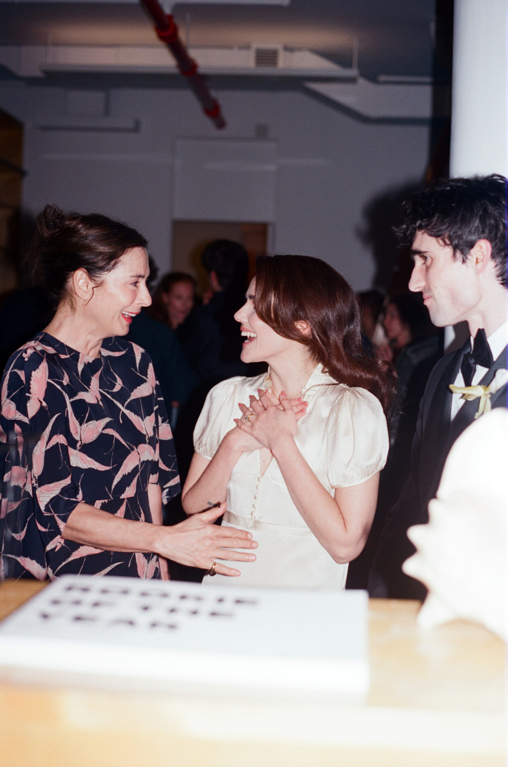 Francesca Amfitheatrof, Sara Apple Maliki, and Pietro Alexander celebrate at the gallery on the couple's wedding day