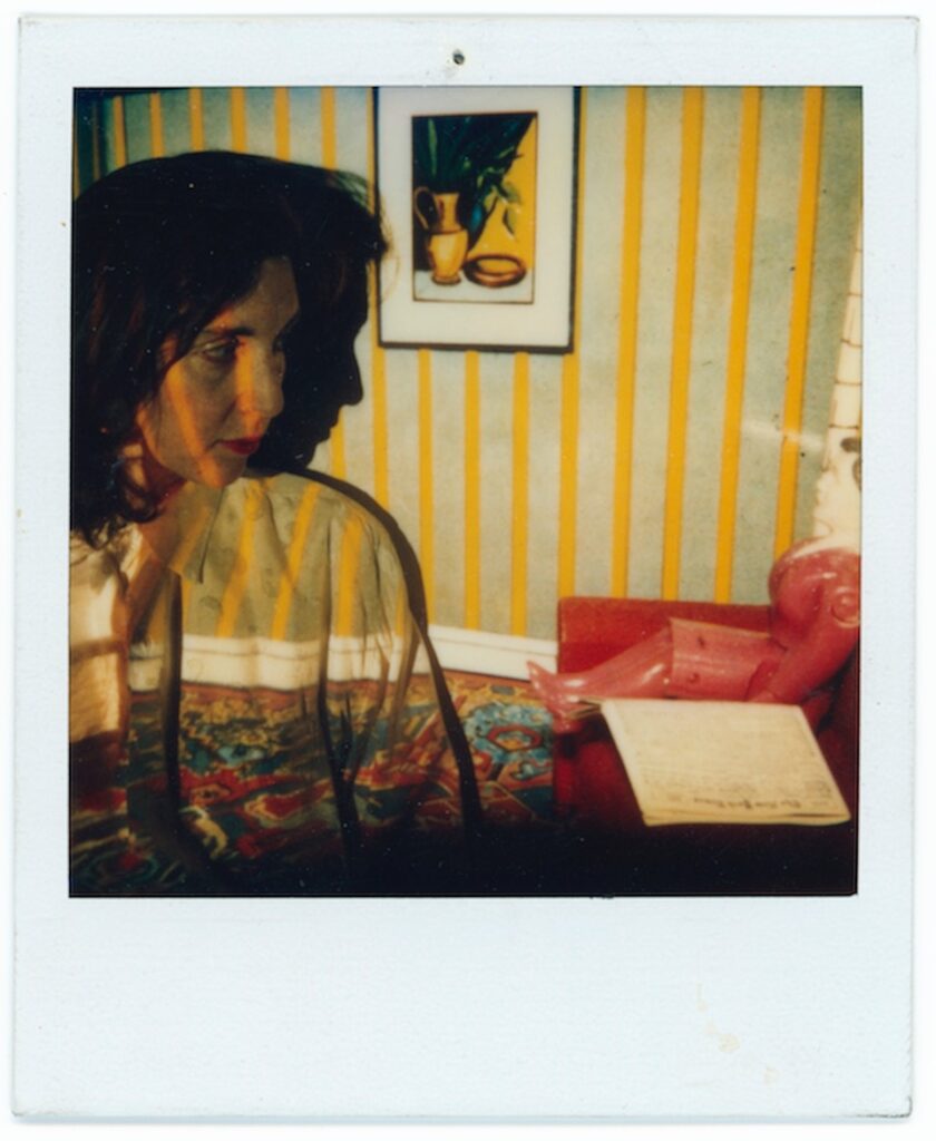 Laurie Simmons with her 1979 show projected onto her