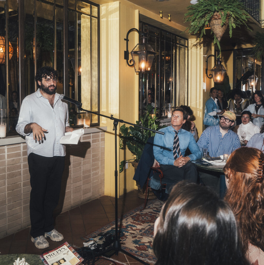 Adam Eli addresses guests at the Fifth Avenue Hotel